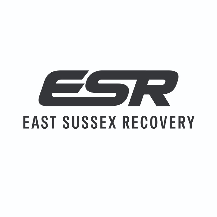 A recovery truck transporting a car and motorcycle A recovery truck transporting a car and motorcycle