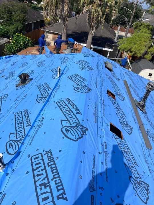 New roof replacement with architectural shingles on a residential home